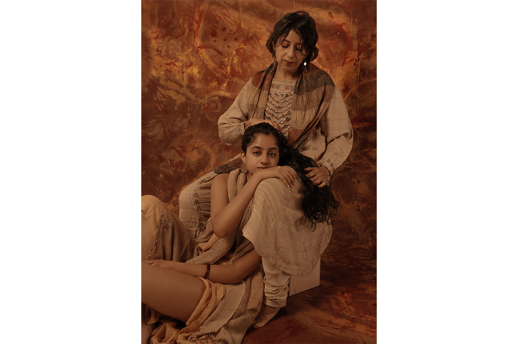 A woman stroking her daughter's hair