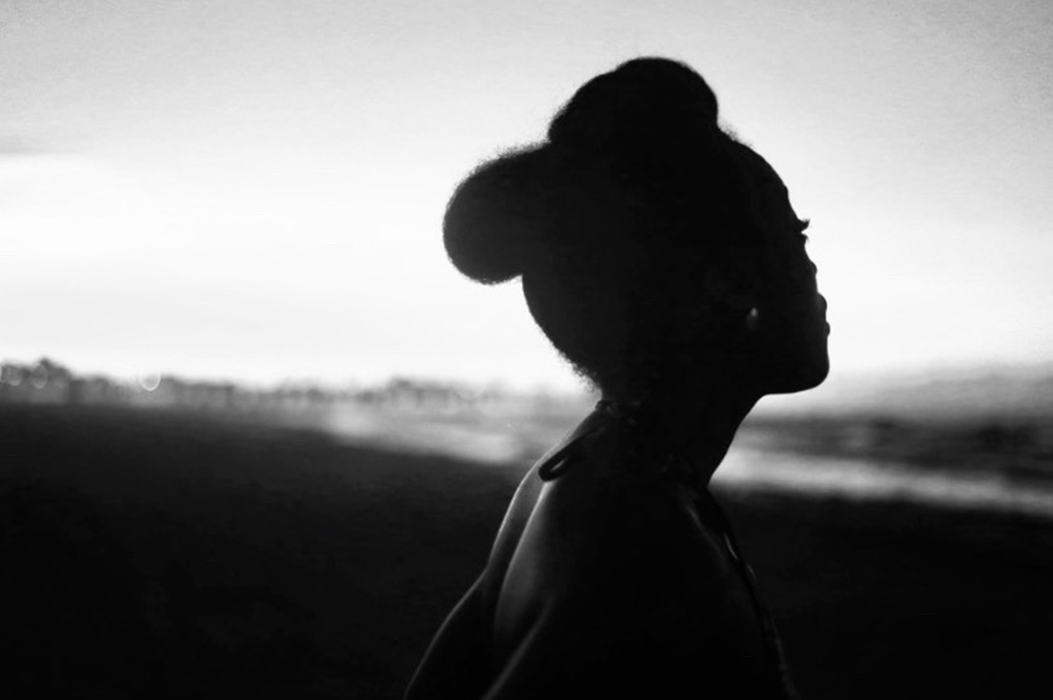 Black & white photo of a woman looking outward