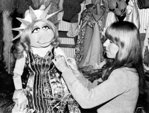 Polly Smith dresses Miss Piggy as the Statue of Liberty