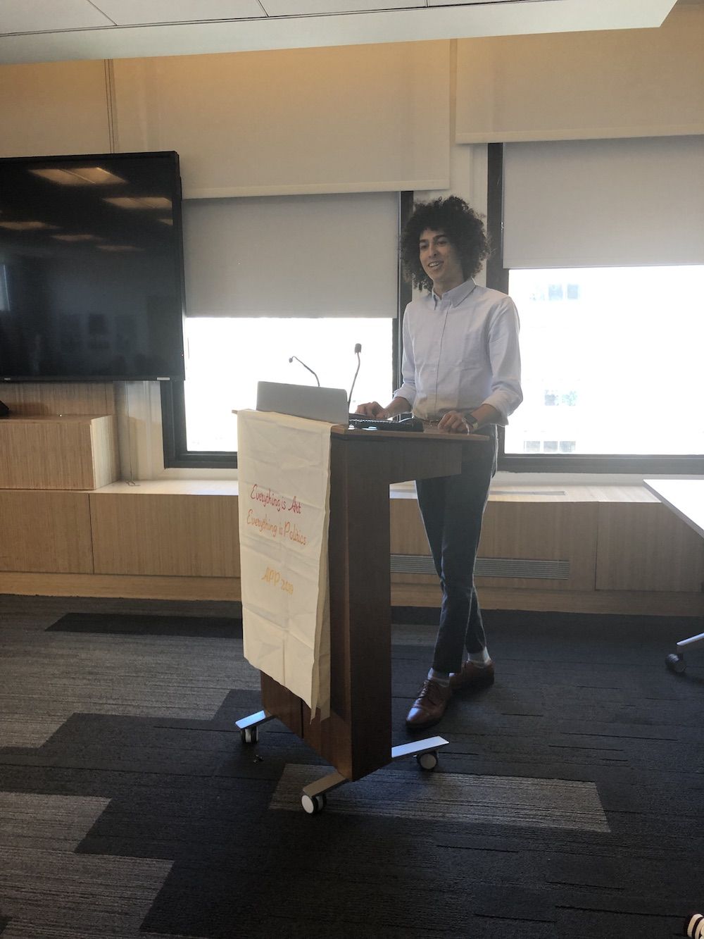 Man stands at a podium reading