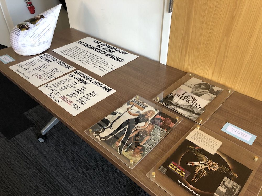 Display table with collages of Jane Fonda and panels with facts about endangered species