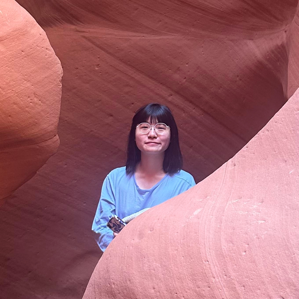 Portrait of Yida with red rocks