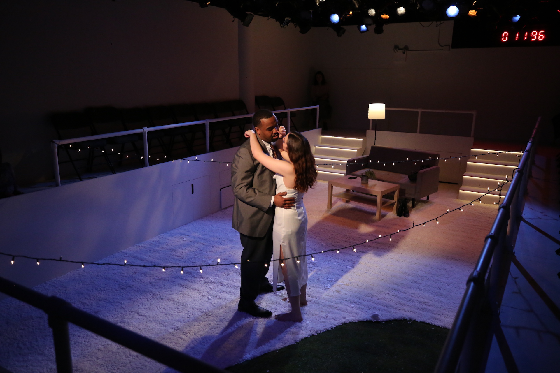 Man and Woman dancing on a white carpet