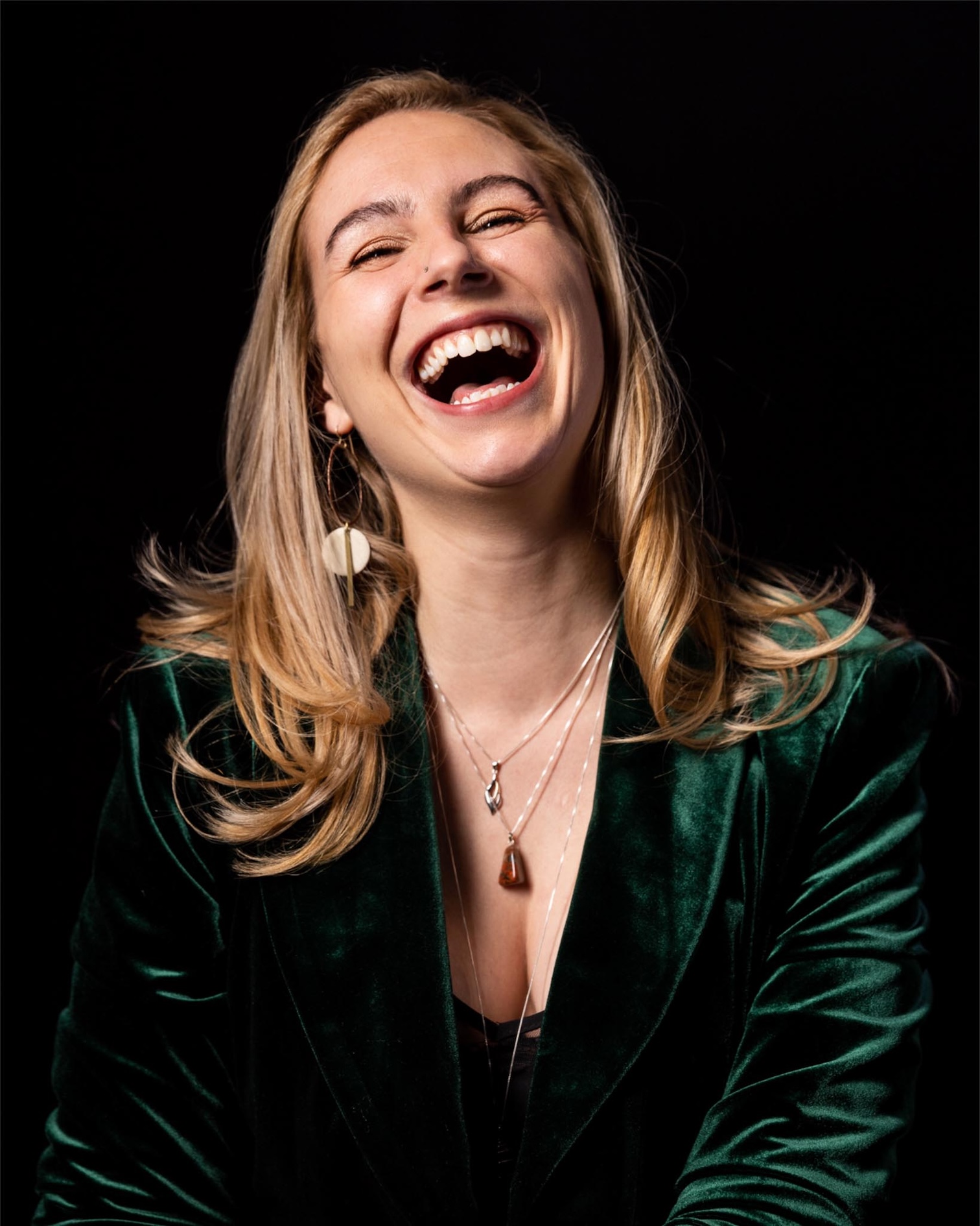 Headshot portrait of Orla Long with black background