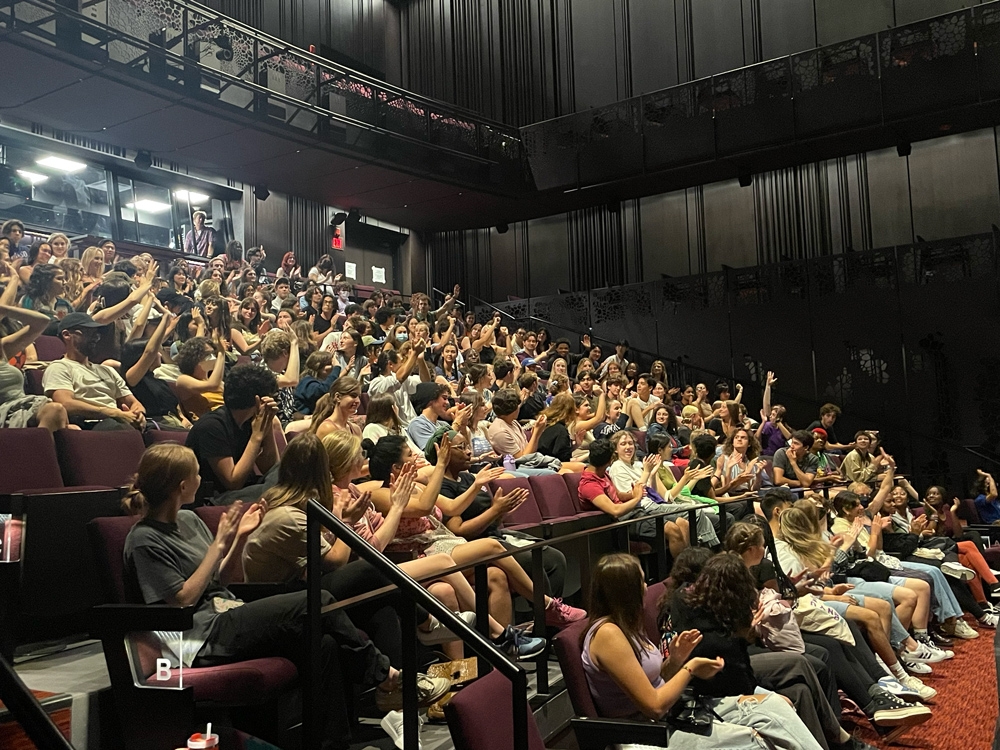 Students cheer each other on as they're placed in teams that will write, direct, rehearse, and present an original ten-minute play in a 24-hour period.