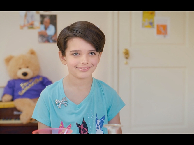 Film Still from Alex and the Handyman. Image of young boy smiling.