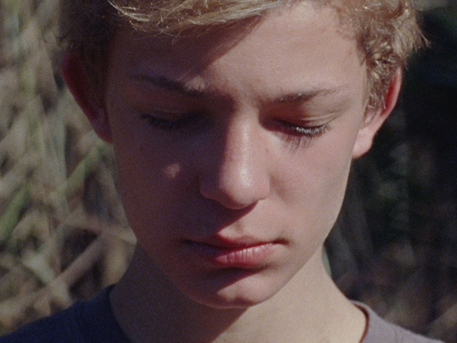 Film Still from get out fast. Image of close up of boys face. 