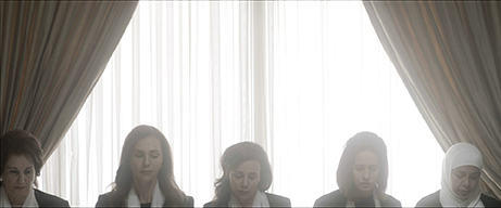 Five women sitting at a table.