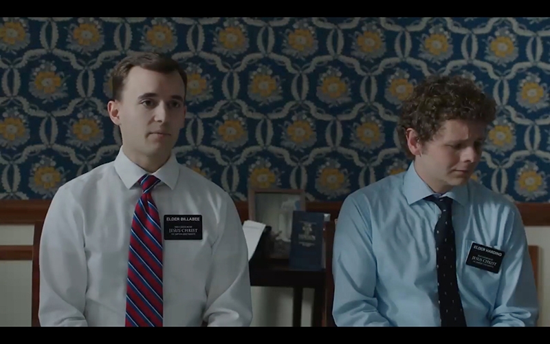 Two young man sitting in an office.