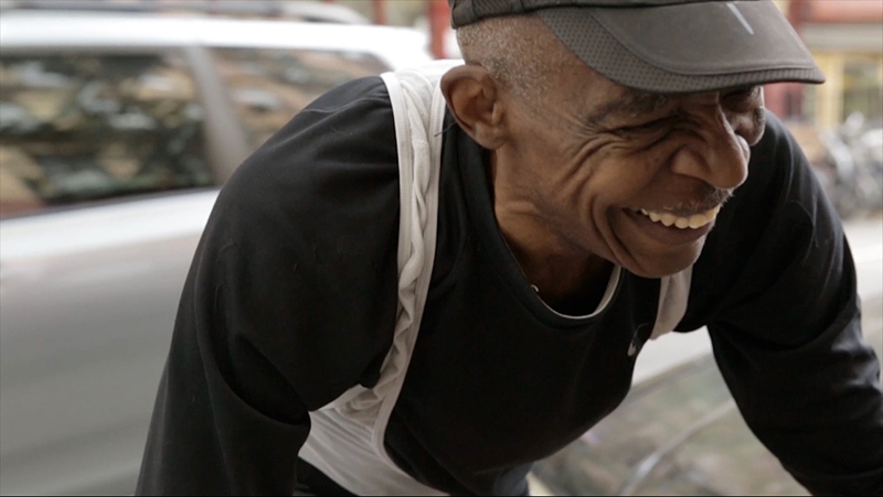 An image of a older man smiling.