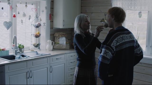 Older woman and younger man in a kitchen