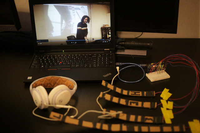 Camper project featuring headphones, wires, and lights plugged into computer