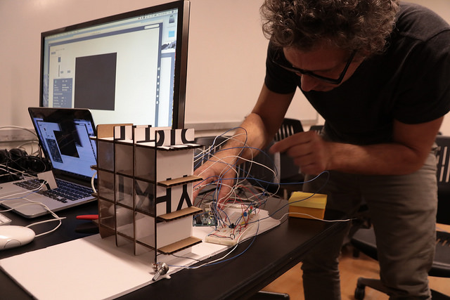 Student works on project with wires attached to his computer