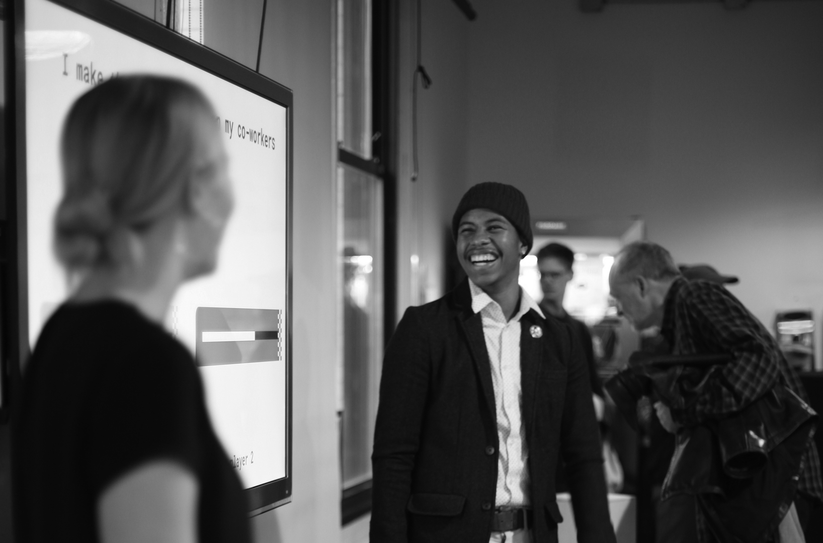 A man and woman laughing at each other