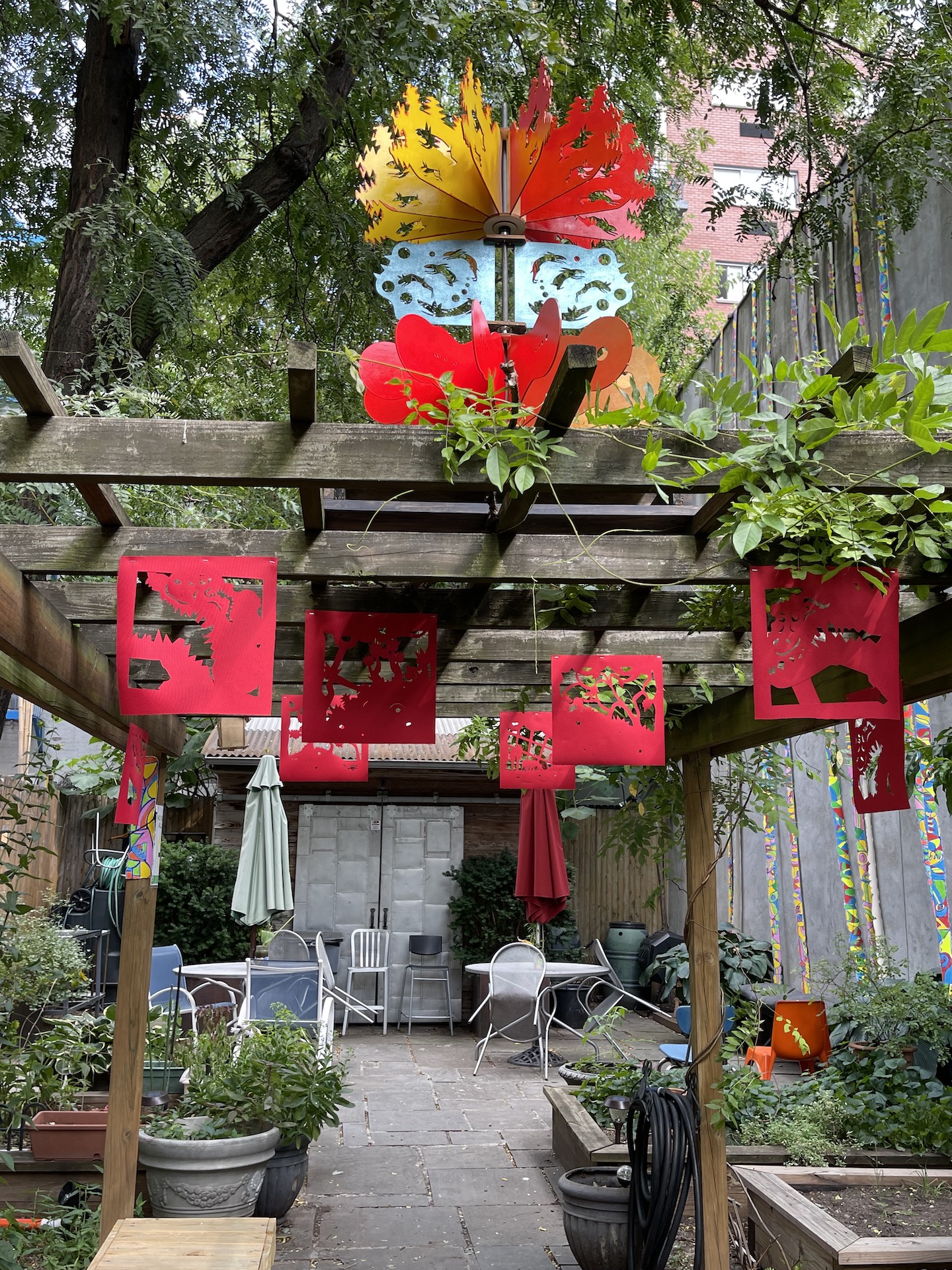 Art hanging from the garden beams