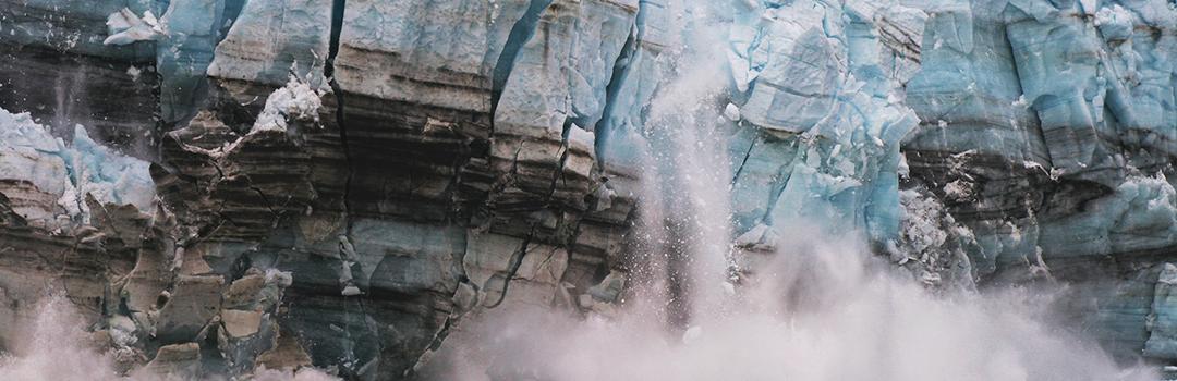 Glacier falling into the ocean