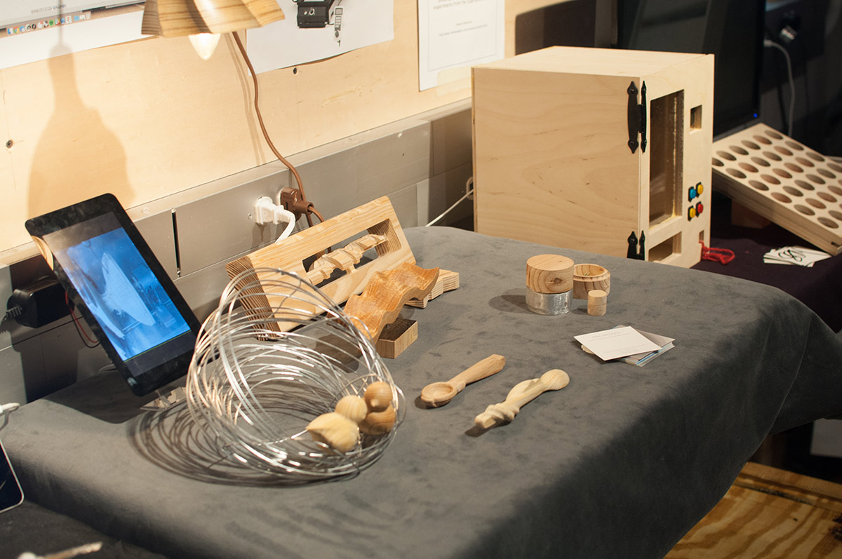 a spiral wire bowl, and other wooden utensils