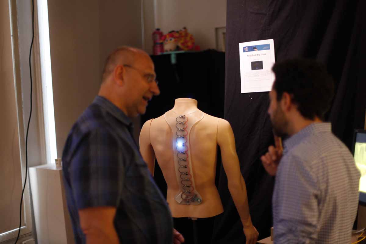 a wearable of lightup sensors along the spine of a headless mannequin