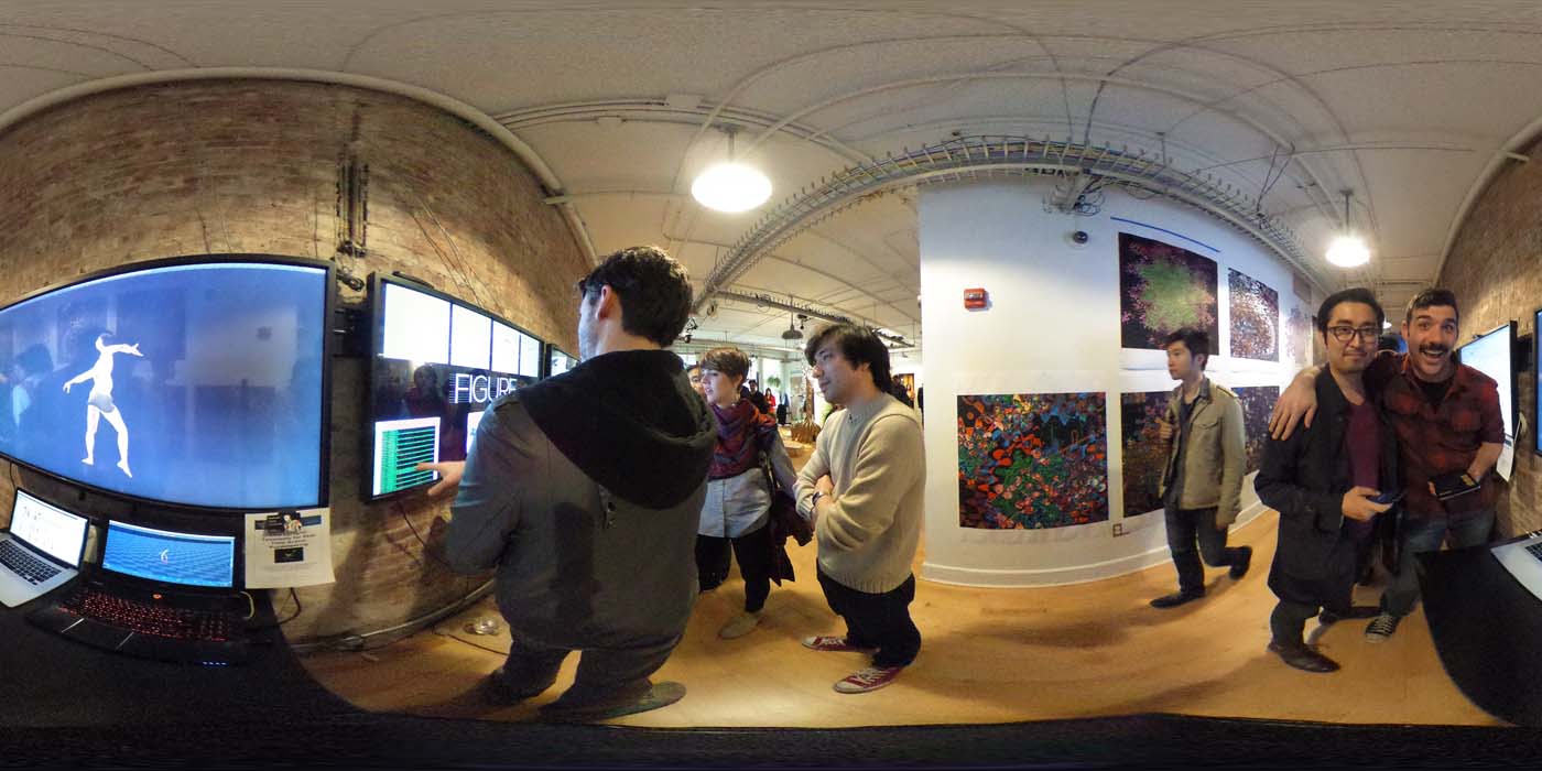 a 360 image of the hallway and people standing by projects at the show