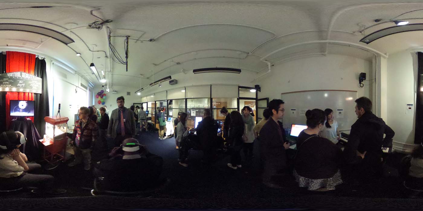 a 360 image of the hallway and people standing by projects at the show