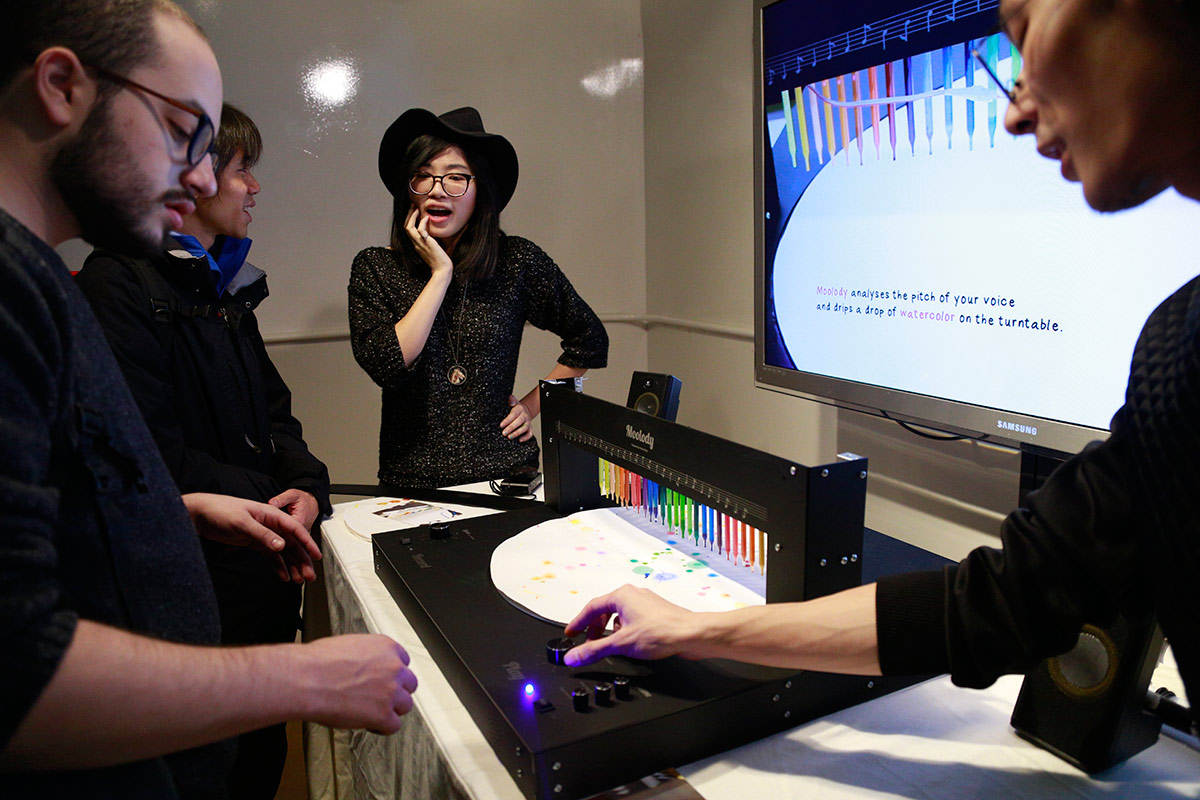 a turntable with droppers of watercolor that drip randomly on the spinning paper