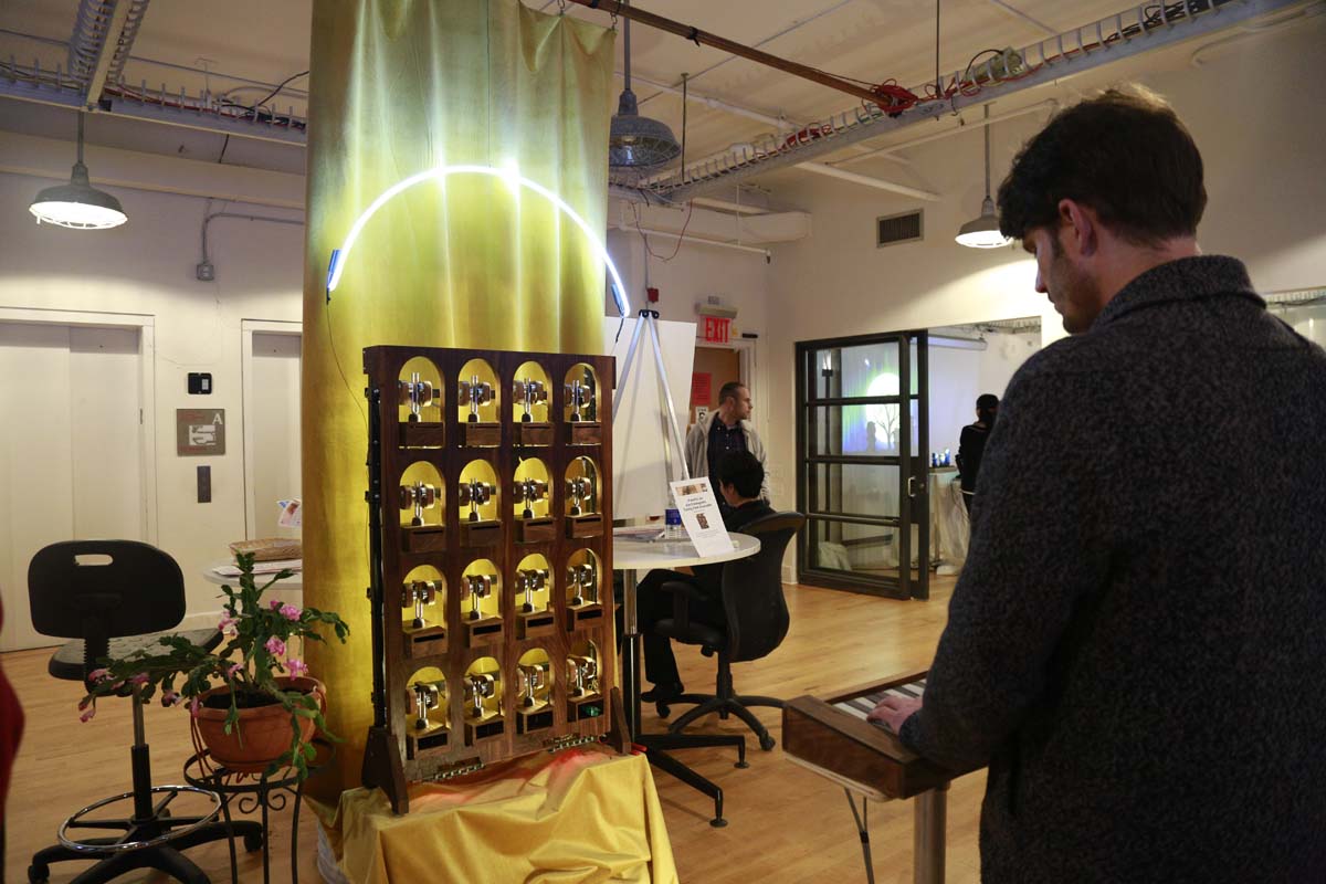 a wooden instrument that clacks with motors hooked up to a keyboard