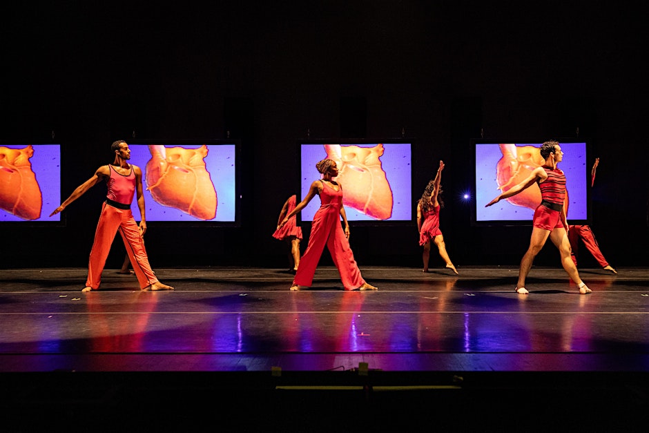 Dancers on stage in colorful clothing