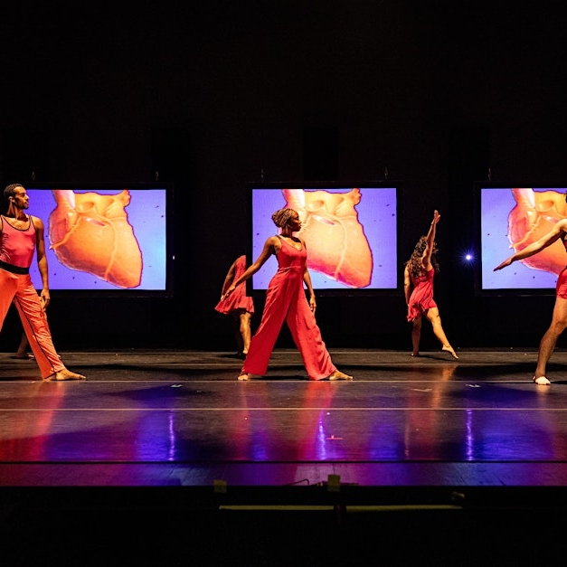 Dancers on stage in colorful clothing