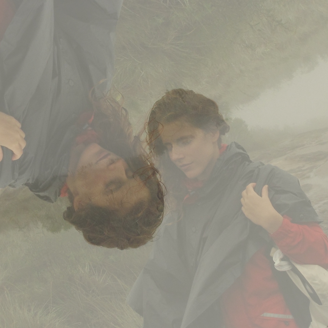 mirrored image of a woman laying on the ground