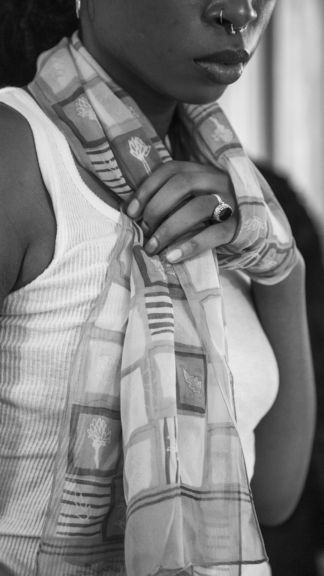 black and white portrait of a woman with a scarf