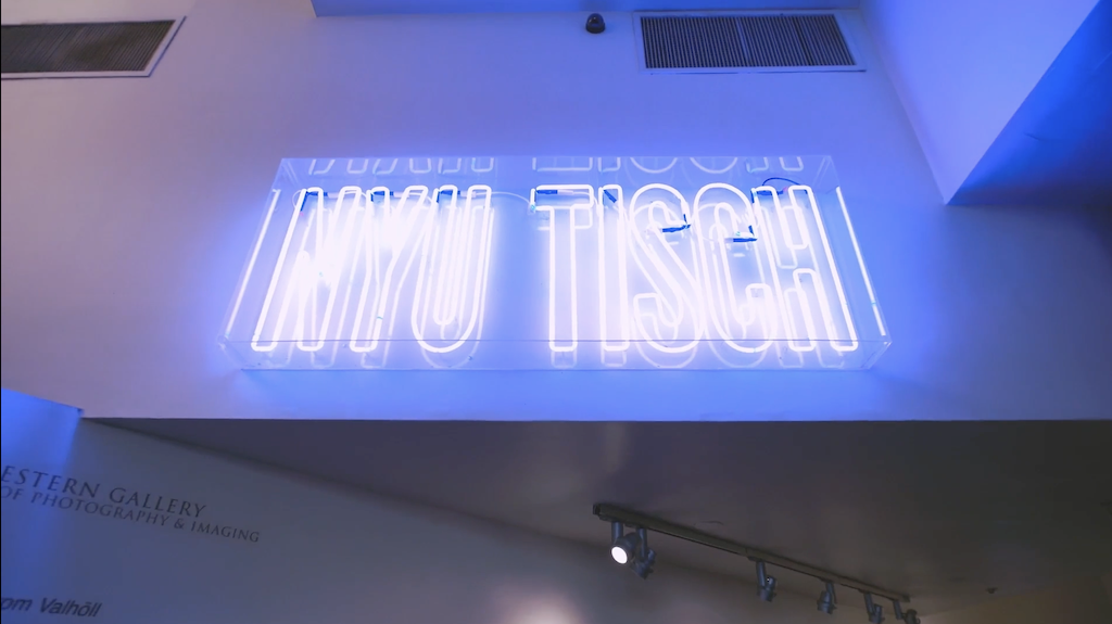 NYU TISCH neon violet sign 