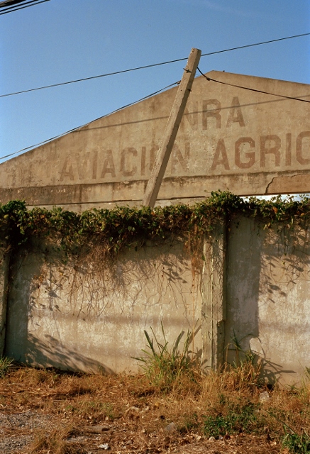 Old agriculture aviation hanger in disrepair.