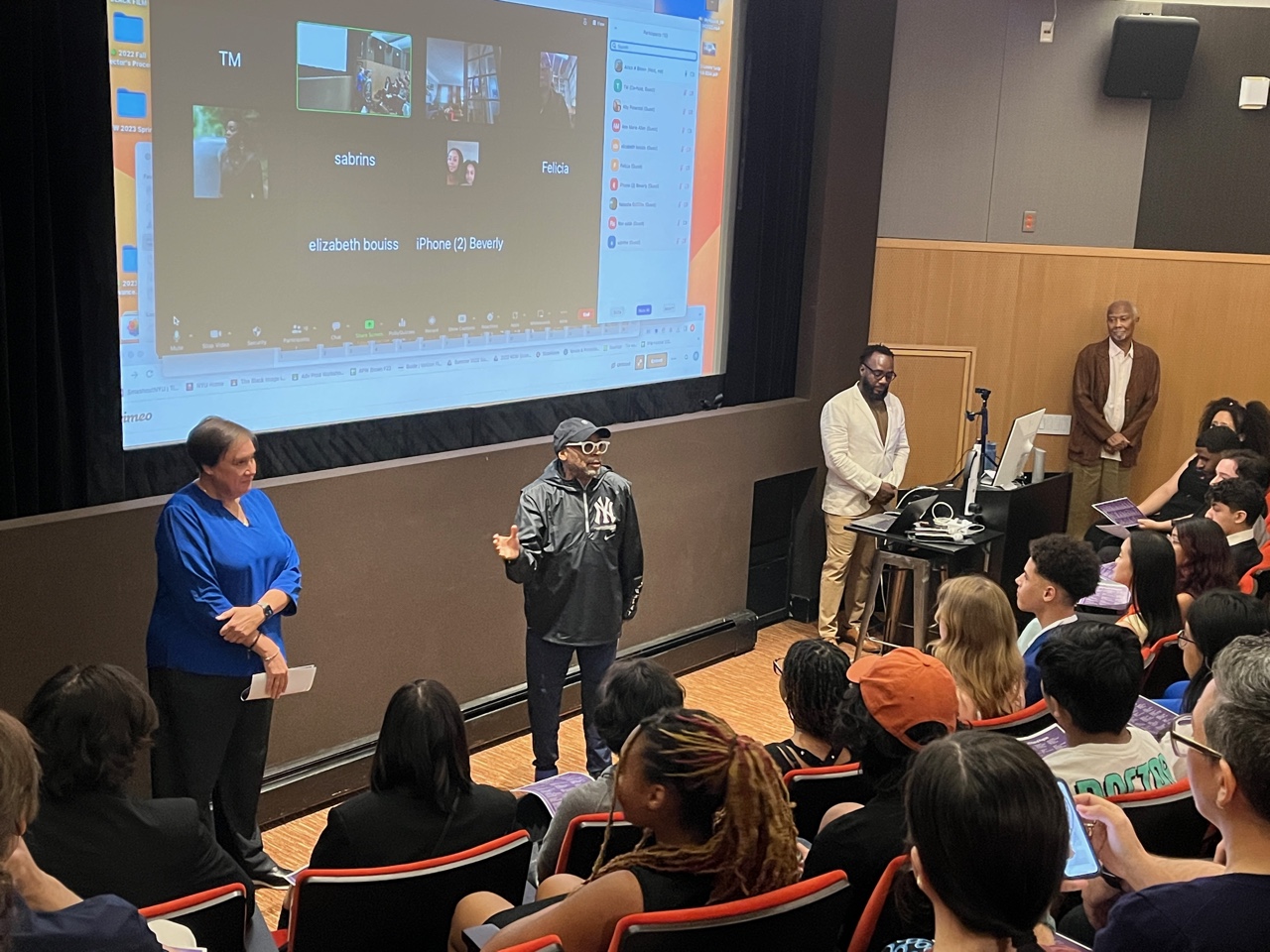 Academy Award® winner and tenured professor Spike Lee Spike Lee stands in front of students seated in a film screening room during the final screening of the spring 2023 Future Filmmakers Workshop.