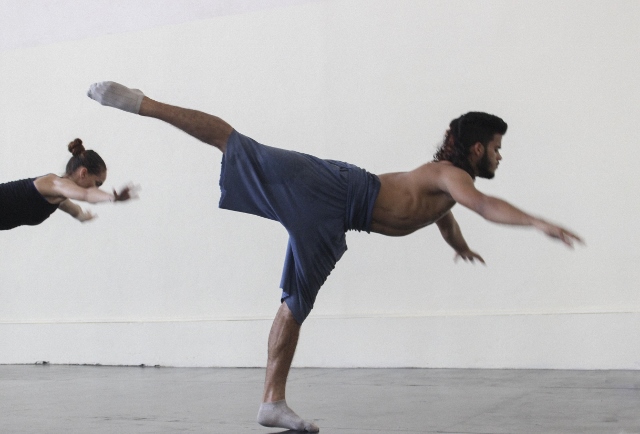 Dancers balancing on one foot, with back leg extending up.