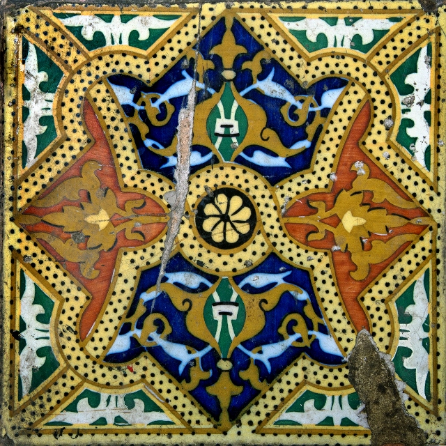 Orange, blue, and white patterned ceramic tiles in Havana.