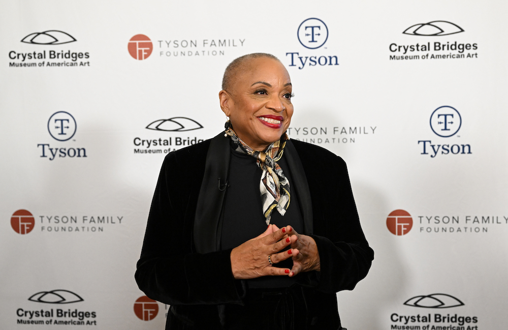 Deborah Willis in front of a step-and-repeat holding an award