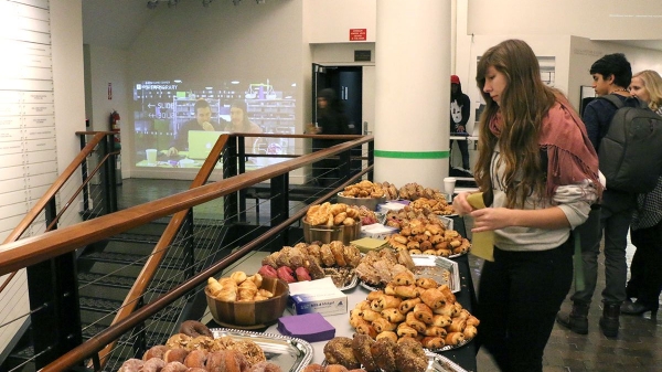 person with a platter of breakfast foods 